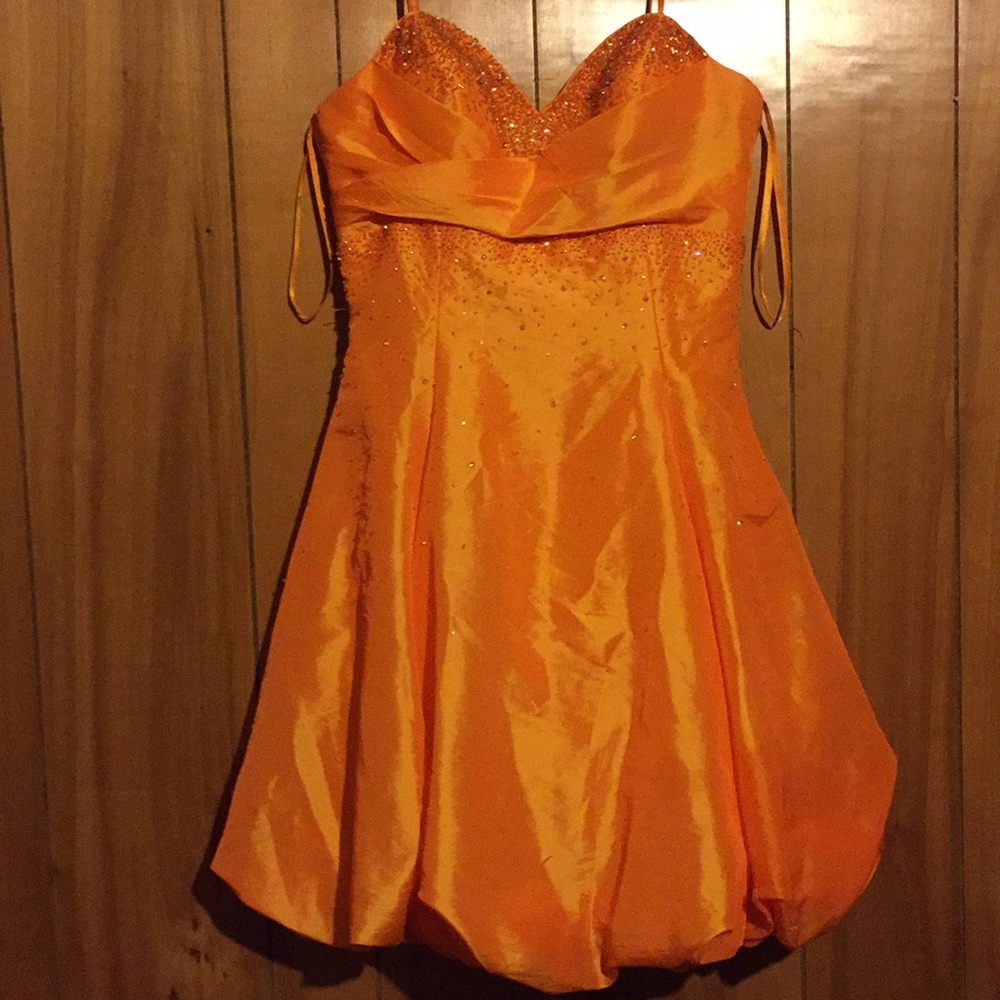 A beautiful orange dress.